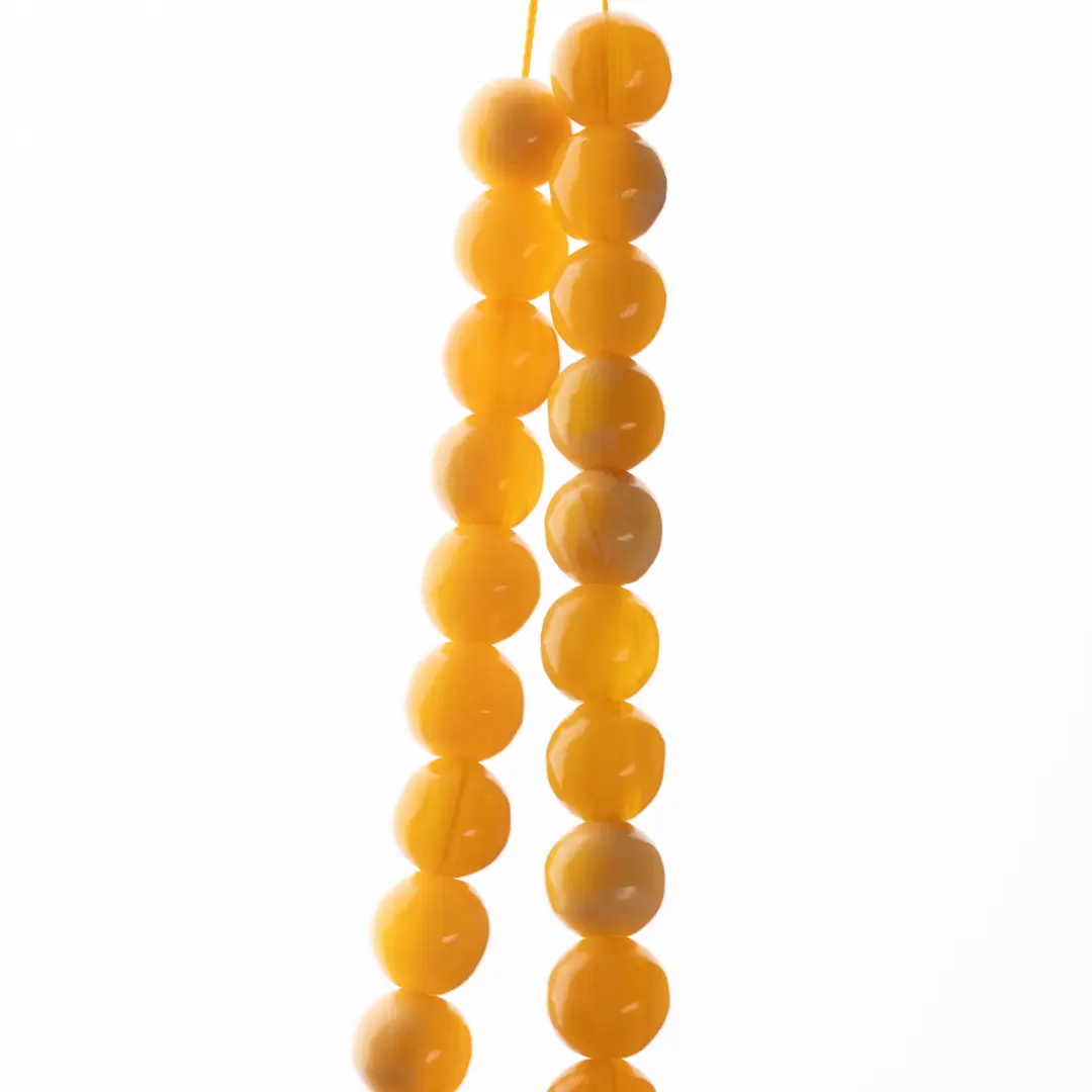 Des perles d'ambre de komboloï en transparence - entre bijou et objet traditionnel grec - Photyne