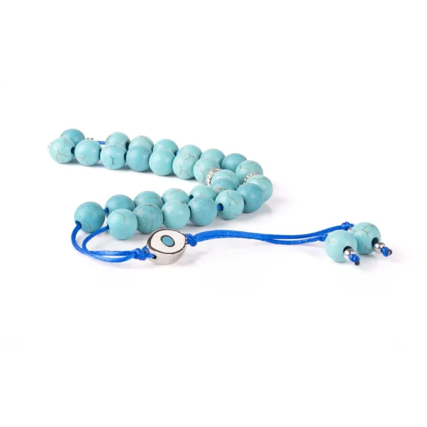 Chapelet grec- Komboloï composé de perles rondes en turquoise avec des nervures naturelles, agrémenté de perles en métal argenté et d'un pendentif représentant un œil protecteur - une création Photyne