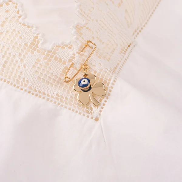 Broche de protection pour bébé contre le mauvais oeil - breloque dorée en forme de trèfle porte bonheur et oeil protecteur émaillé- Photyne
