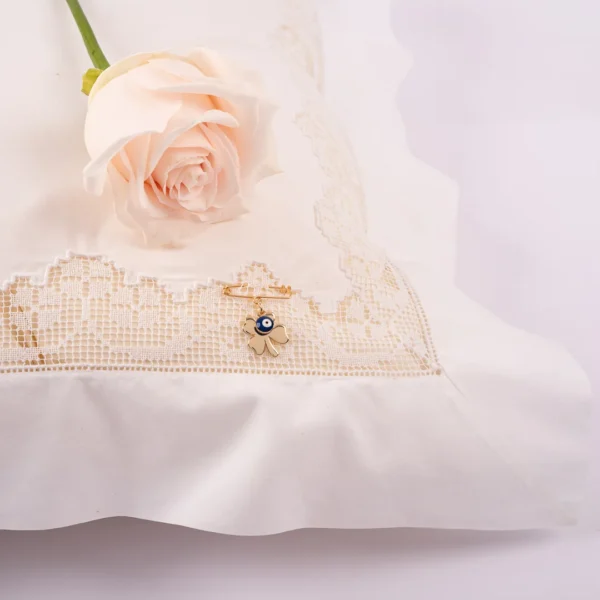 Broche porte bonheur pour bébé - breloque dorée et oeil protecteur - Photyne